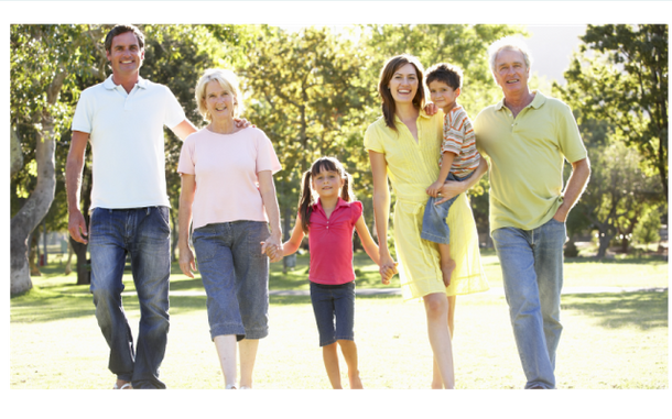 Multi-generational family walking together outdoors