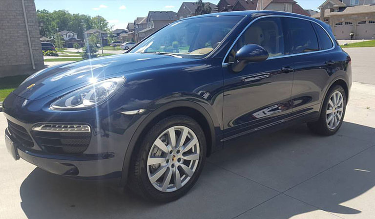 Cleaning EDGE exterior detailing on a dark SUV in London Ontario