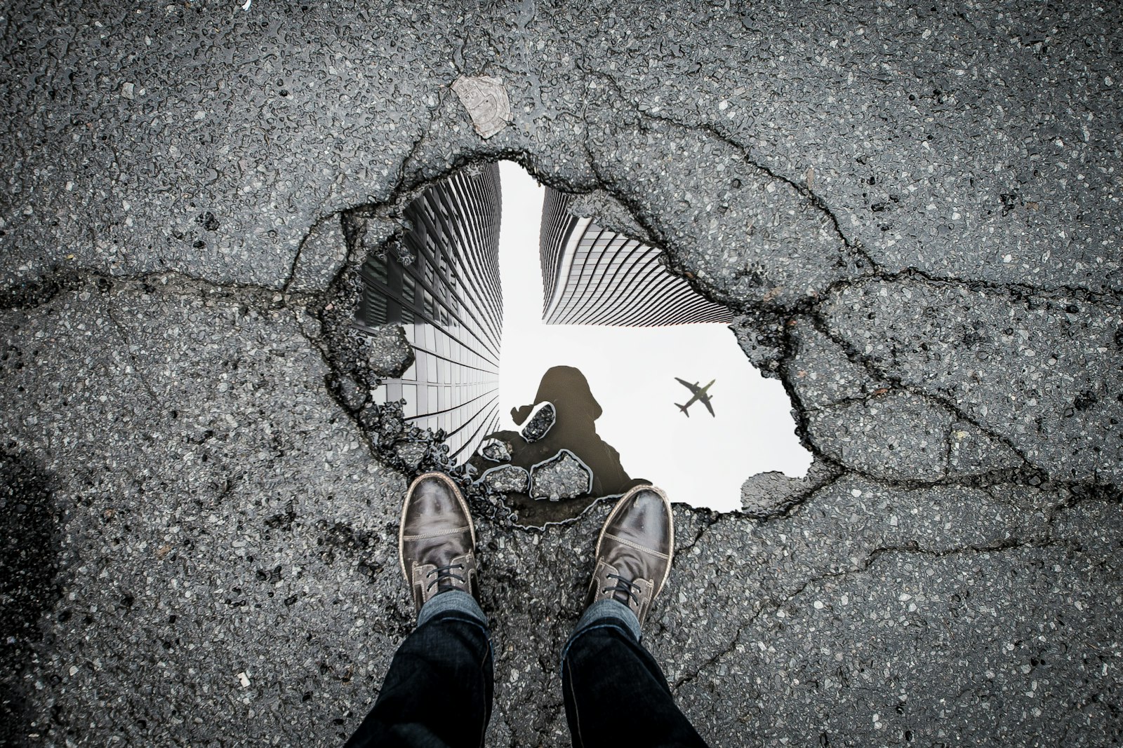Cracked asphalt marked for repair, the kind of damage CraftWell Group fixes in London Ontario