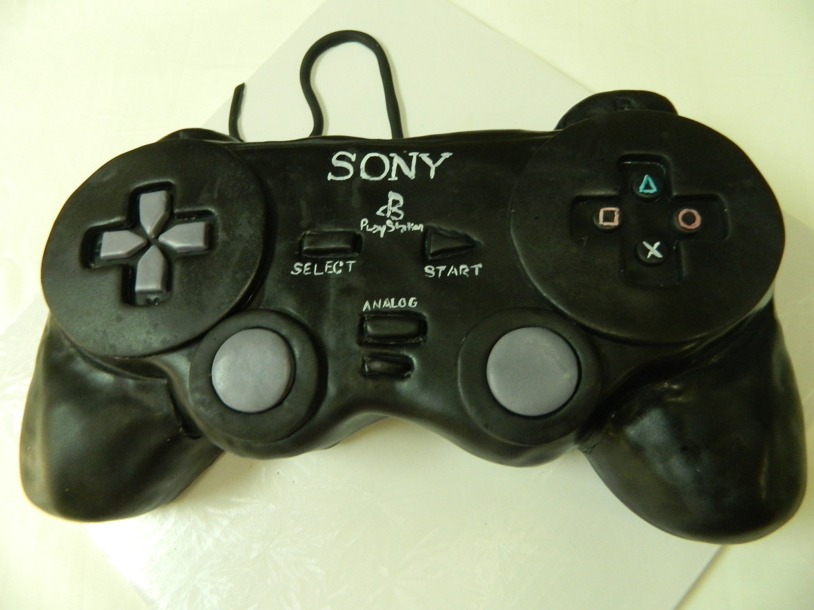 PlayStation controller sculpted cake by Hey, Cupcake! in London Ontario