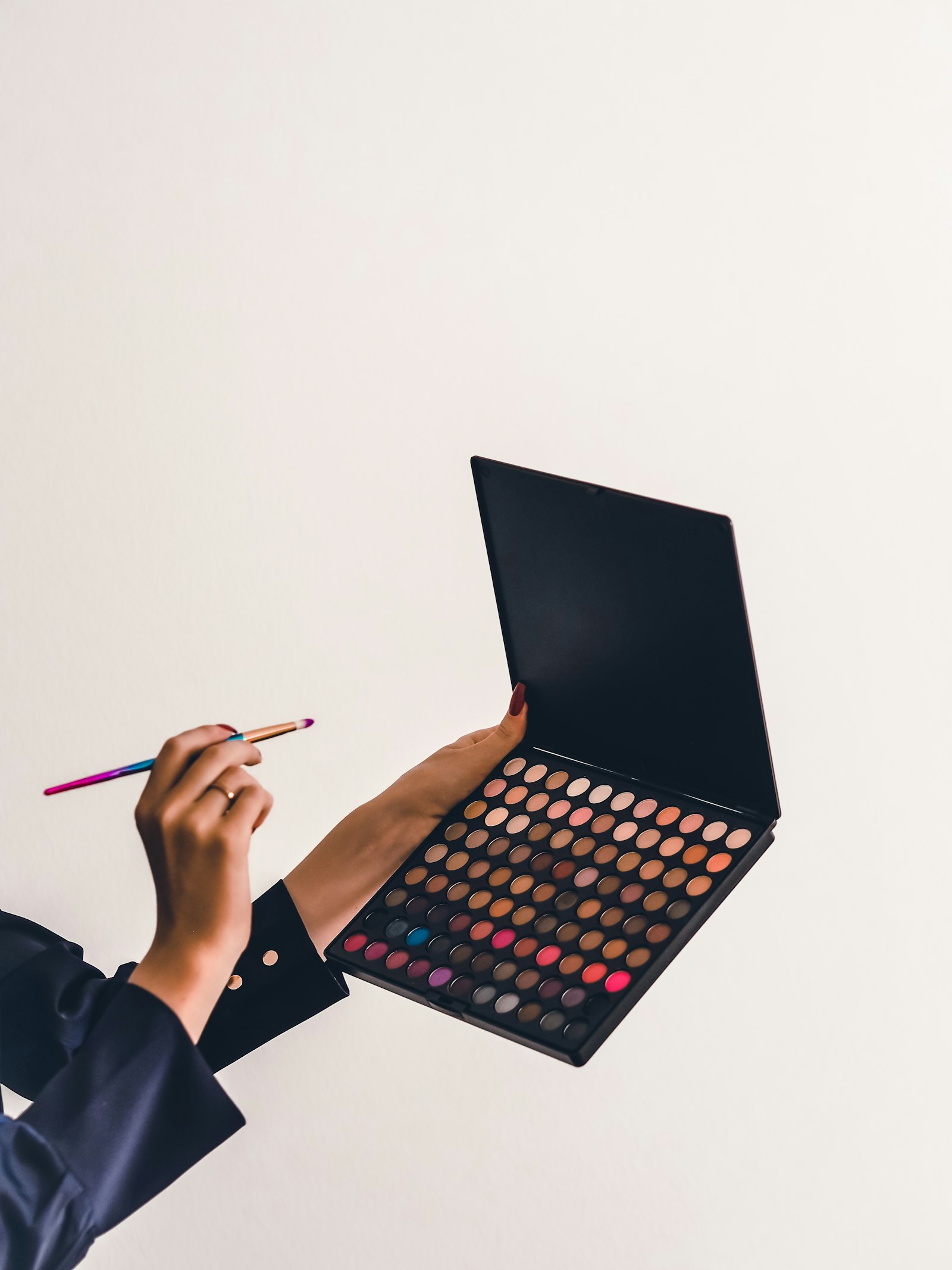 A cosmetic pigment palette and brush used for permanent makeup work