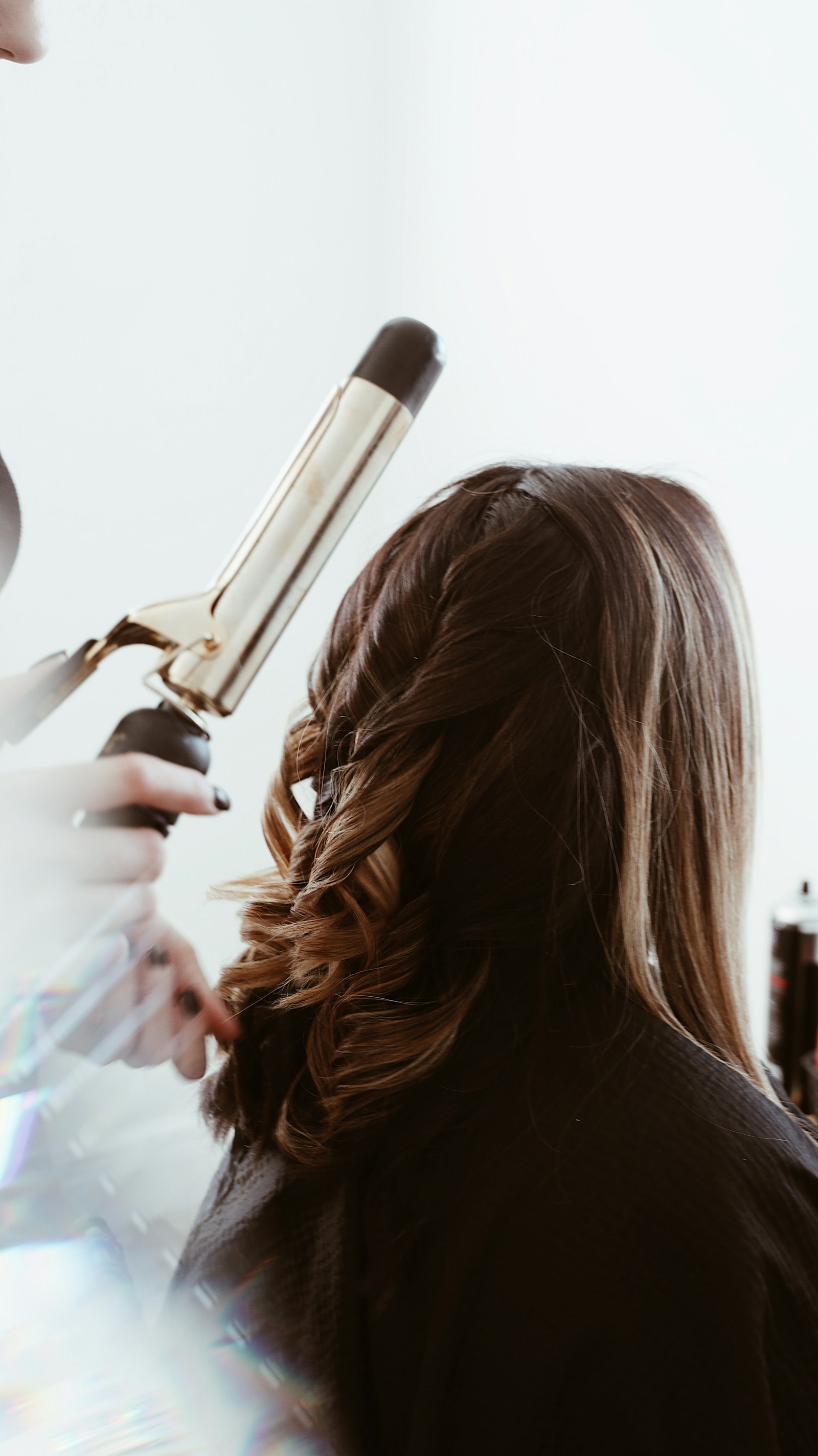 Soft, hand-styled waves on lived-in balayage colour