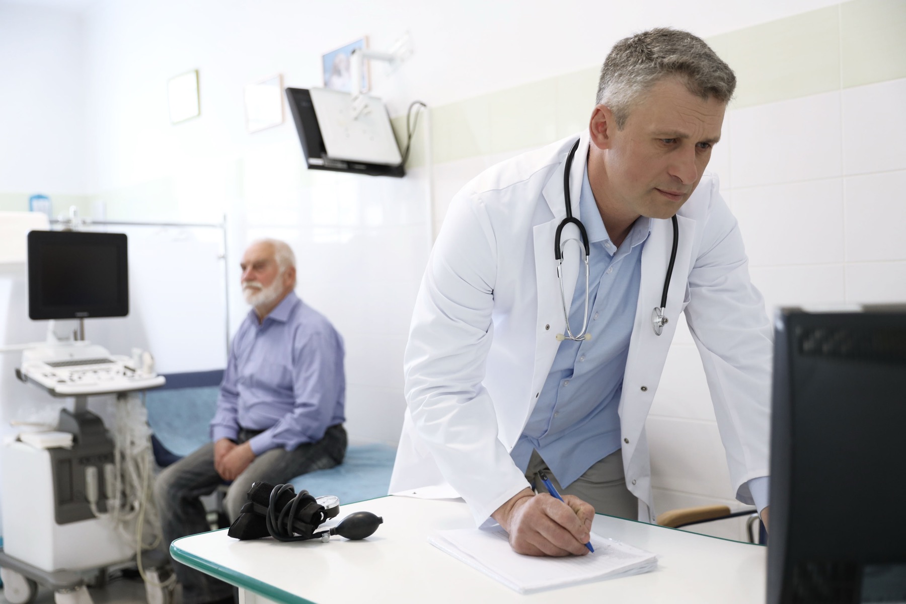 A Medpoint physician reviewing a patient's screening results in clinic, London Ontario