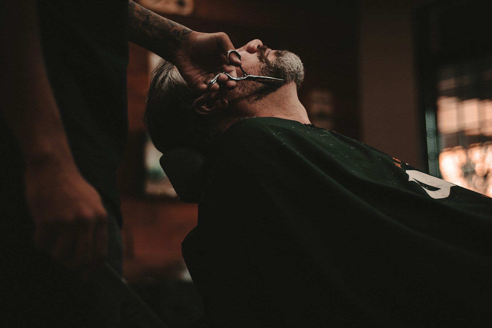 A gentleman receiving a traditional shave at Michael Romeo Hair