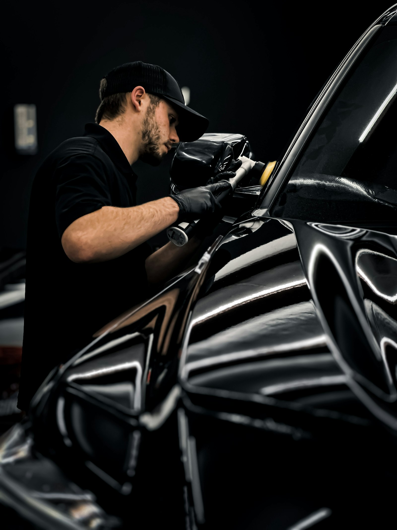 Hand polishing and waxing a car at the owner's driveway, Mobile Auto Shine London
