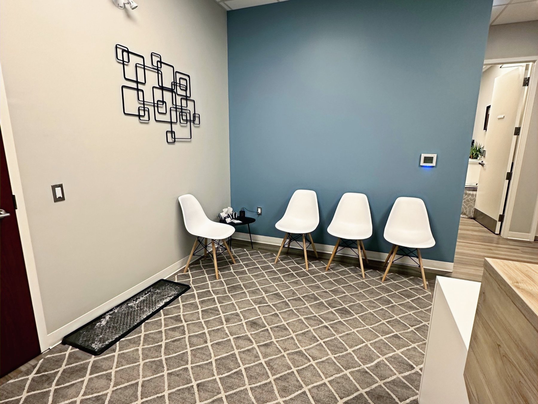 Riverbend Massage Therapy waiting room with blue accent wall