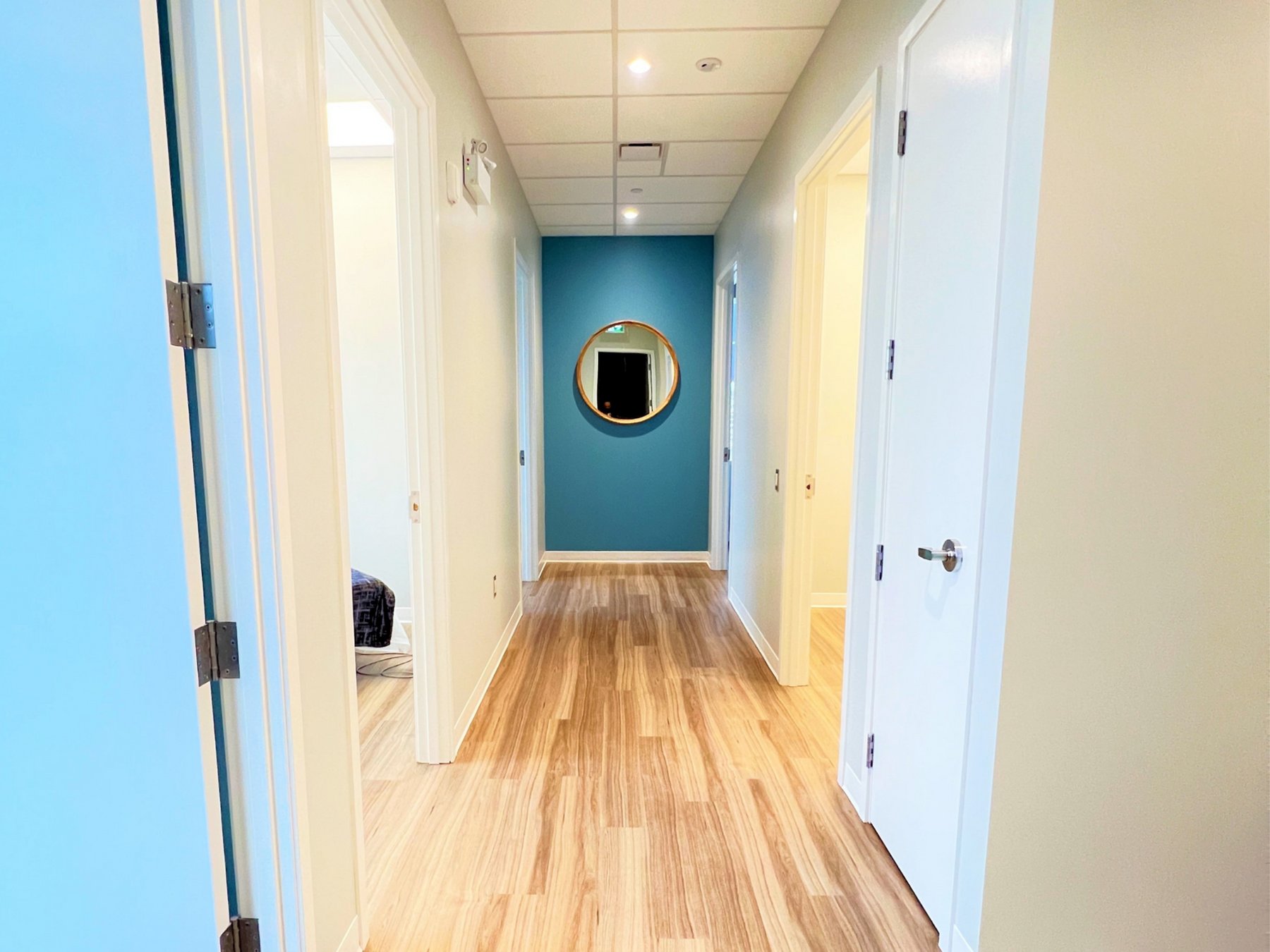 Bright hallway leading to treatment rooms at Riverbend Massage Therapy