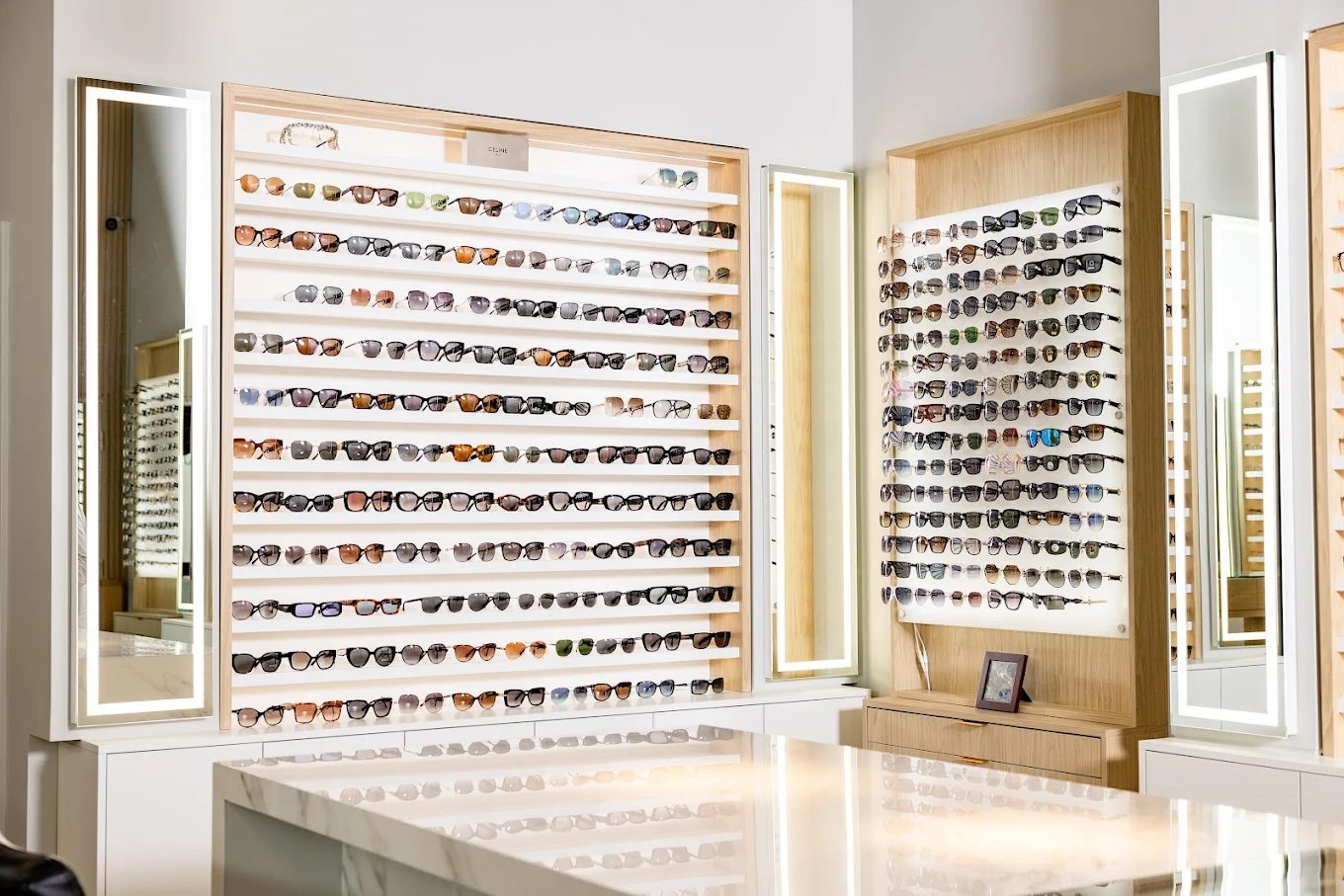 Designer frames lining the display wall at Squints Optical, London Ontario