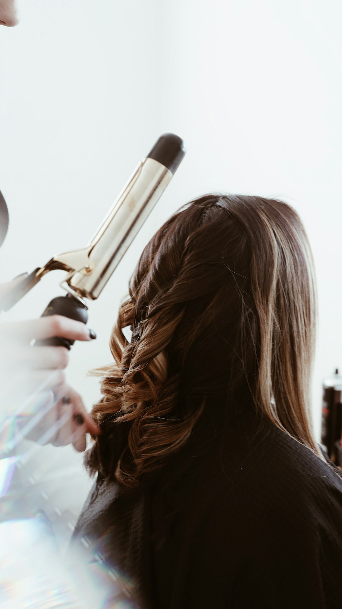 Susan Elston styling a client's hair in her Byron home studio, London Ontario