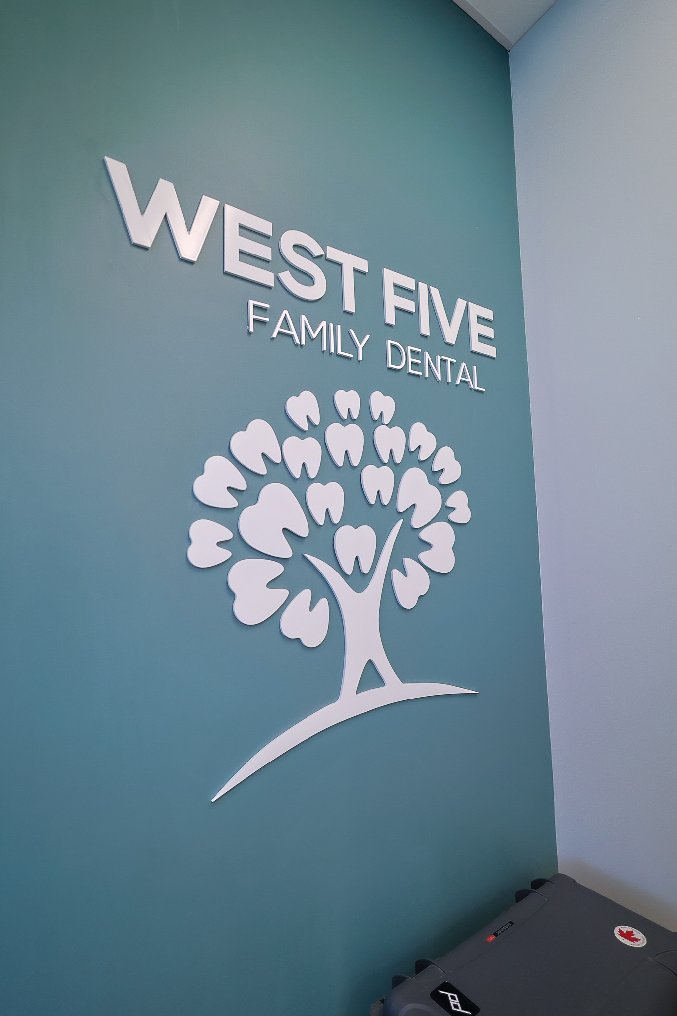 Our logo inside the office at West Five Family Dental, London Ontario