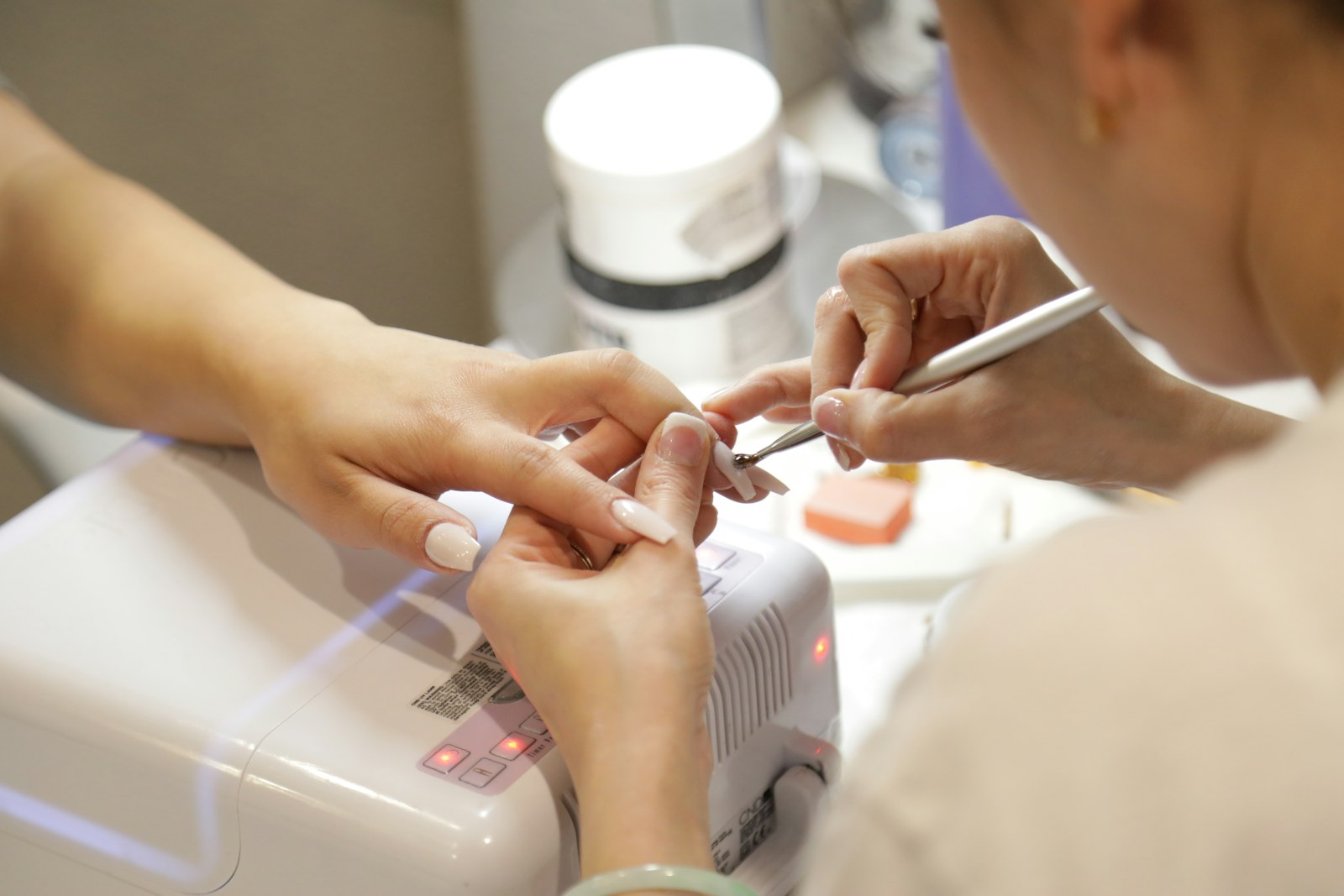 Nail technician at work at Zenn Nail Bar, London Ontario