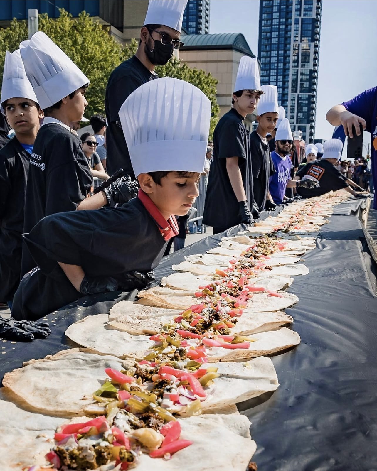 Chef on the falafel wrap line.
