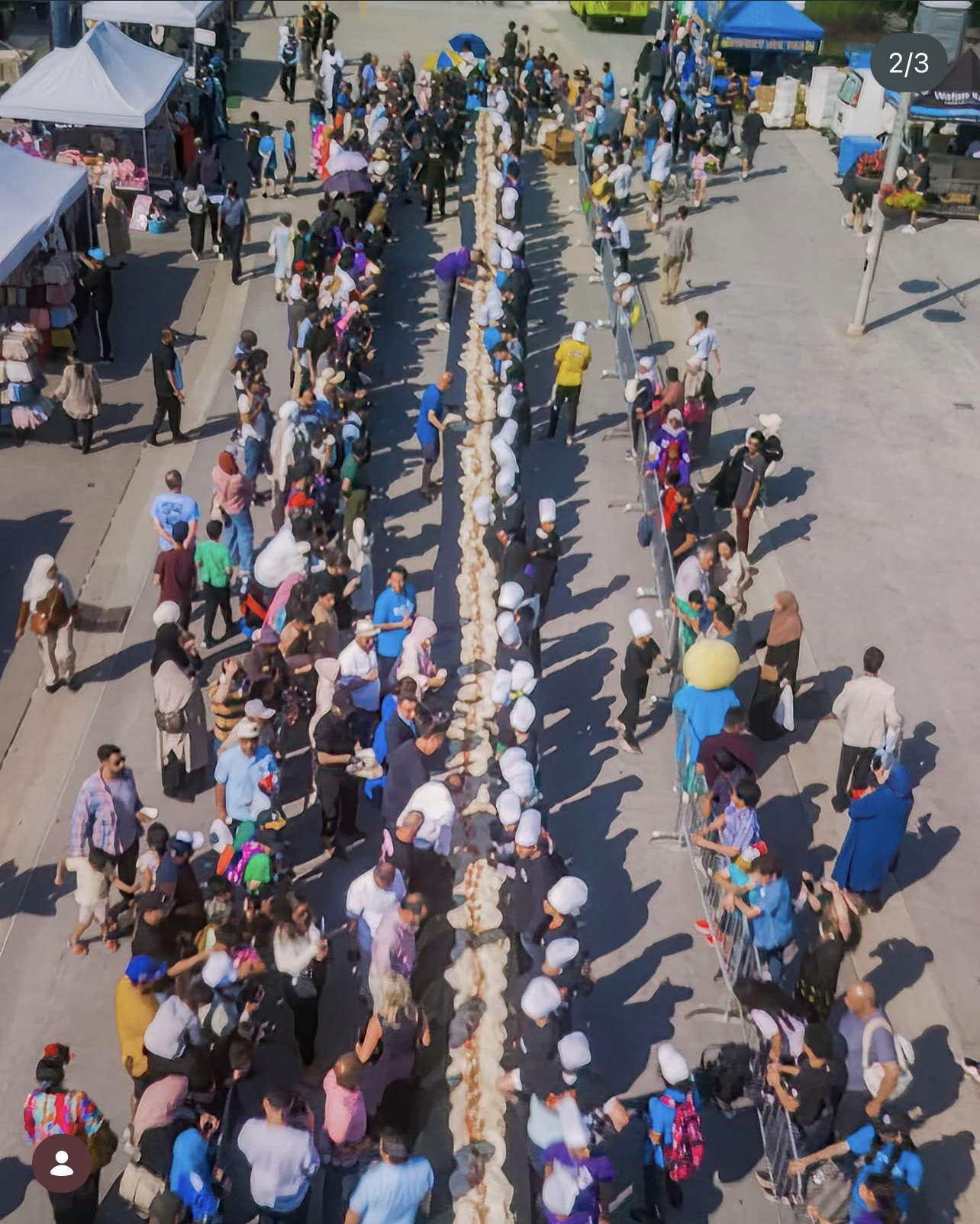 Aerial of the World's Longest Falafel Wrap down a Mississauga street.